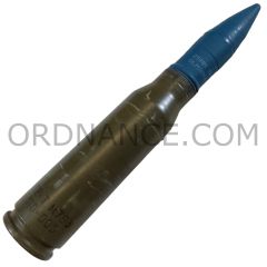 25mm 25x137 Bushmaster TP-T M793 round with fired case, white lettering on projectile